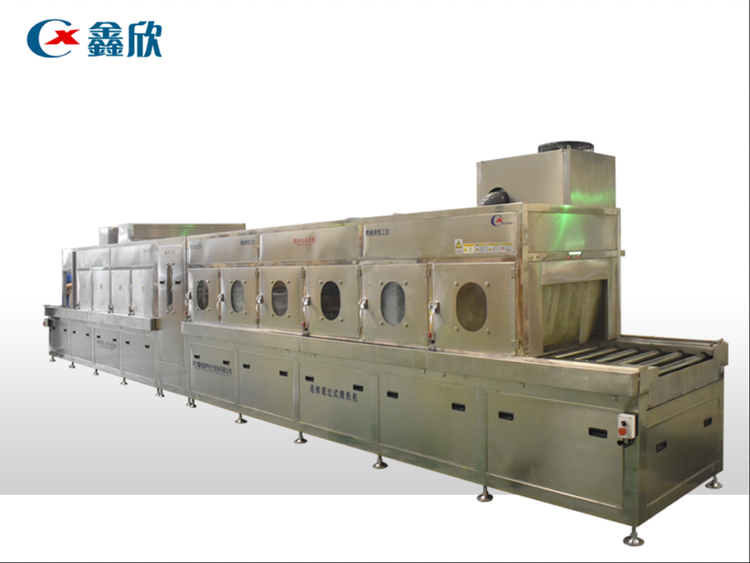 Wheel hub continuous pass cleaning machine